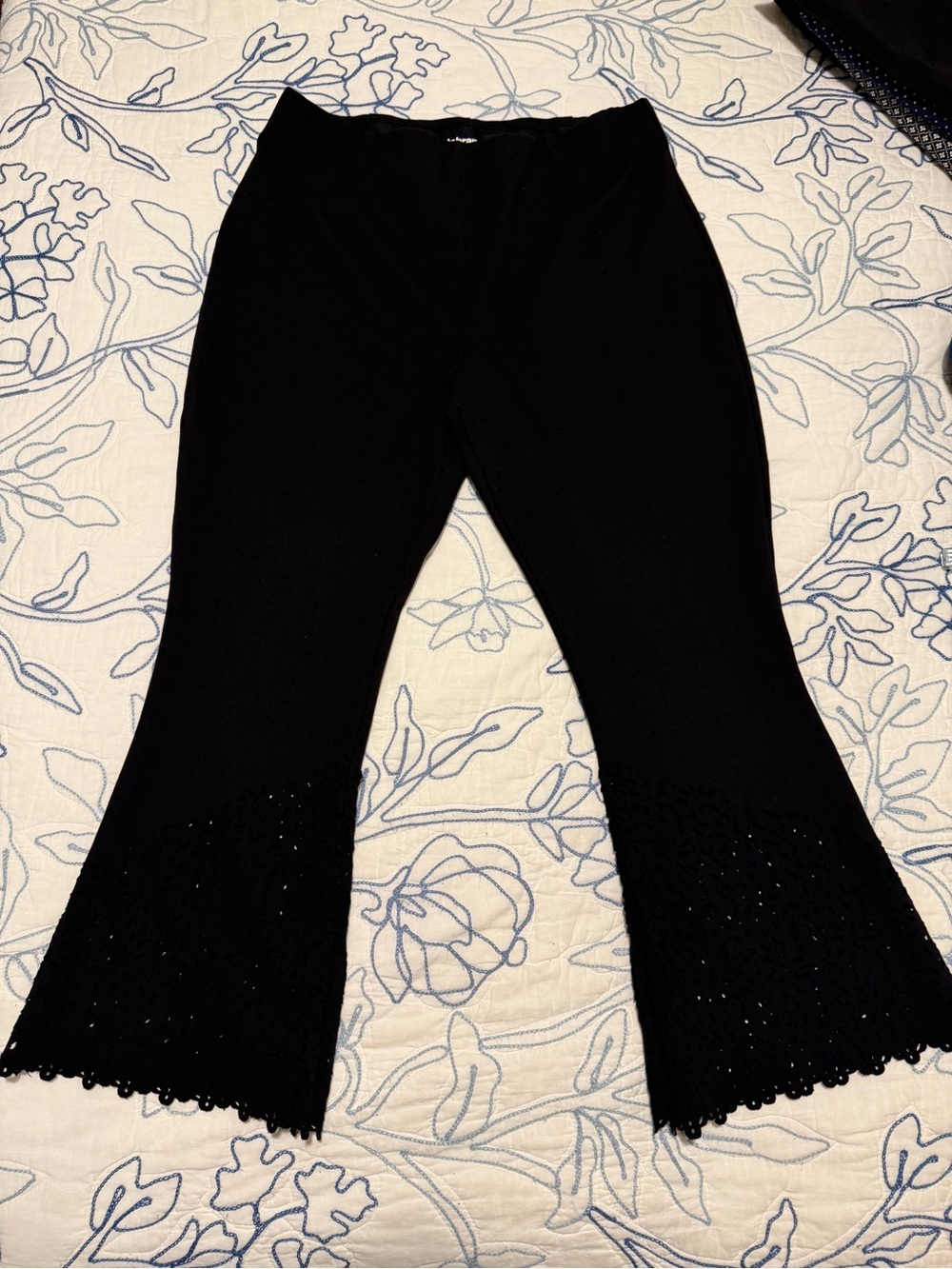Betabrand Black Knit Flare Capris with laser detailed hem